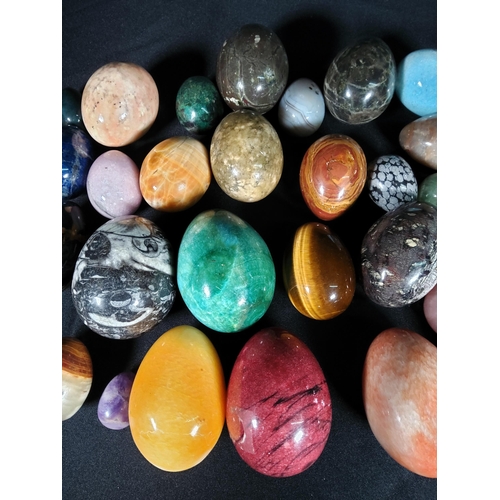 104 - Selection of various stone eggs