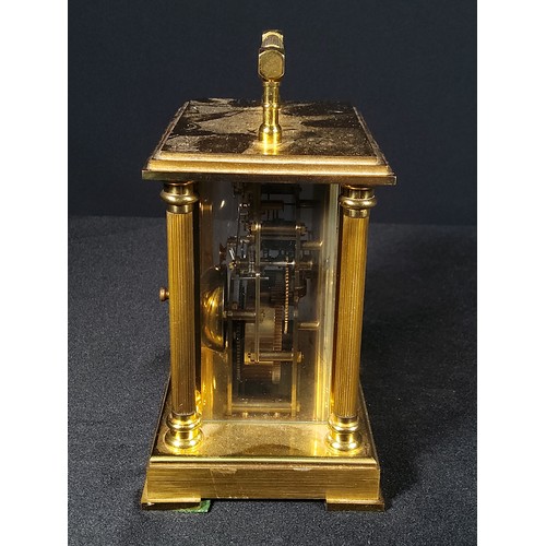 123 - Brass Column mounted carriage clock with bell movement, 12cms in height