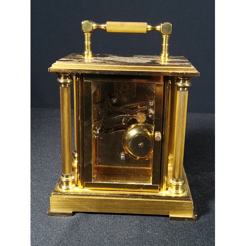 123 - Brass Column mounted carriage clock with bell movement, 12cms in height