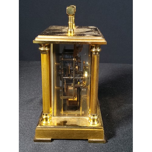 123 - Brass Column mounted carriage clock with bell movement, 12cms in height