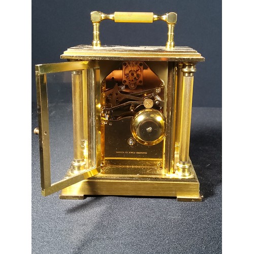 123 - Brass Column mounted carriage clock with bell movement, 12cms in height