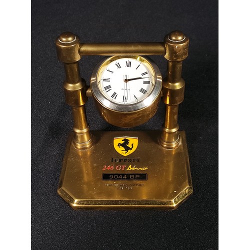 105 - Brass Clock marked Ferrari, Cased traveling clock and 2 miniature bottles of guiness