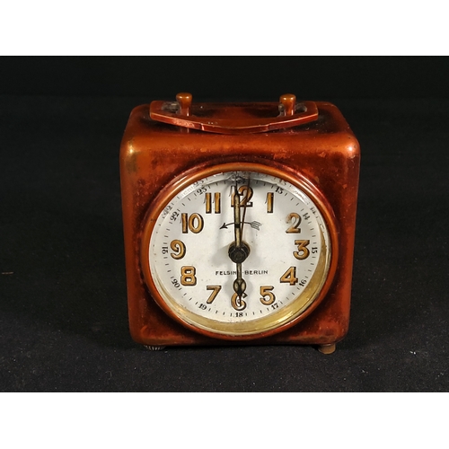 133 - Leather cased german traveling clock and Small Bedroom clock with day and date by Looping