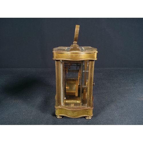 134 - Vintage brass shaped case carriage clock with enamel dial