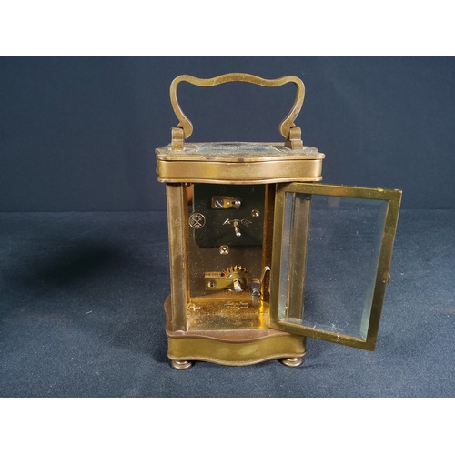 134 - Vintage brass shaped case carriage clock with enamel dial