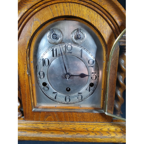 137 - Antique oak cased bracket clock with barley twist columns, 32cms in height