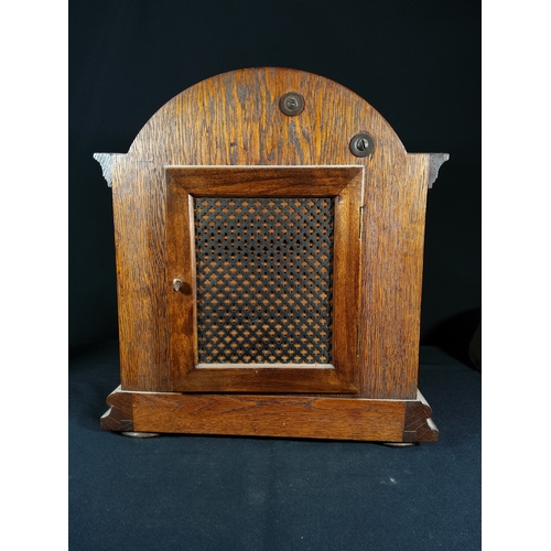 137 - Antique oak cased bracket clock with barley twist columns, 32cms in height