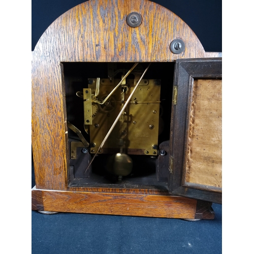 137 - Antique oak cased bracket clock with barley twist columns, 32cms in height