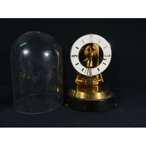 138 - Anniversary clock with glass dome