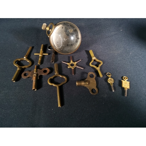 140 - Ball clock and selection of clock and watch keys, ball clock is 6cms in diameter