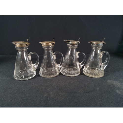 166 - 4 silver stopped jugs, 1 with crack, 10cms in height