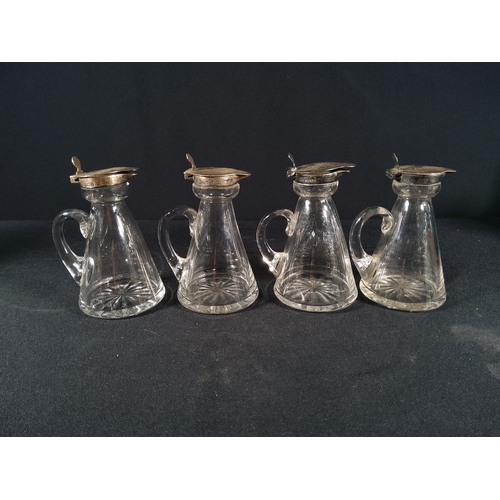 166 - 4 silver stopped jugs, 1 with crack, 10cms in height