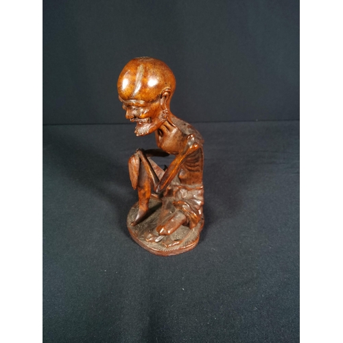 191 - Carved hardwood figure of oriental man, 16cms in height