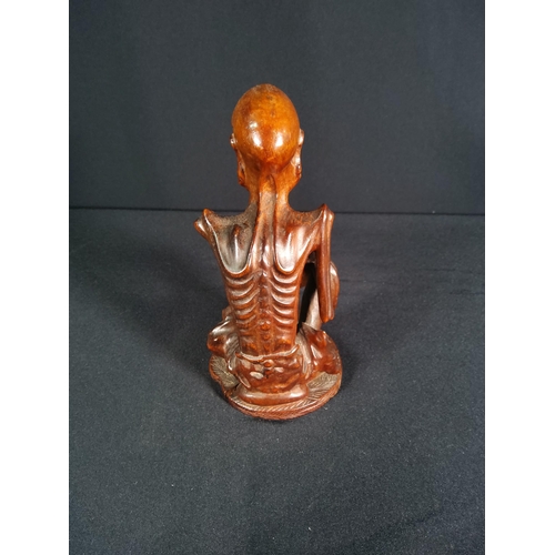 191 - Carved hardwood figure of oriental man, 16cms in height