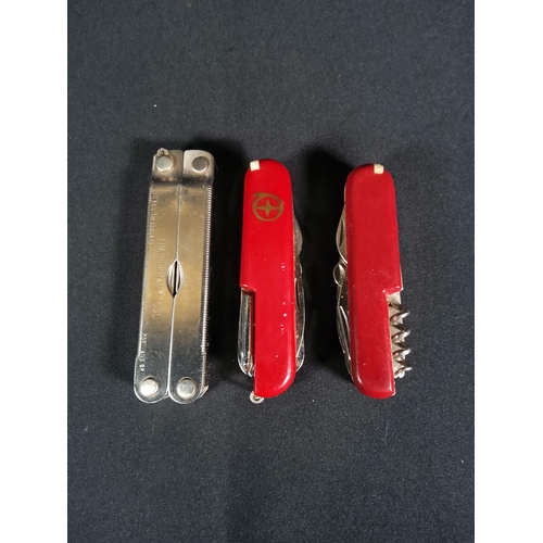 193 - Leatherman cased knife and 2 other multipurpose  knifes