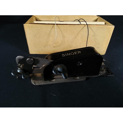 108 - Boxed singer button hold attachment