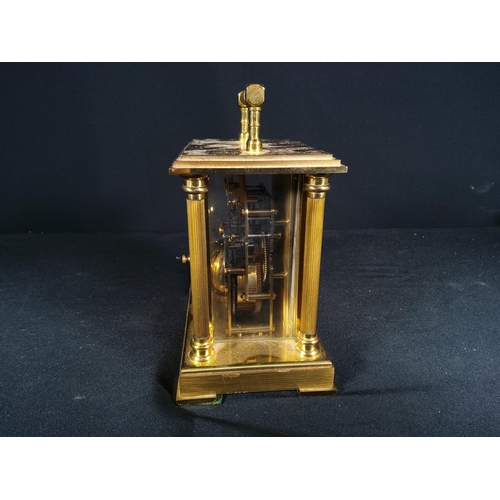 123 - Brass Column mounted carriage clock with bell movement, 12cms in height