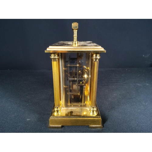 123 - Brass Column mounted carriage clock with bell movement, 12cms in height