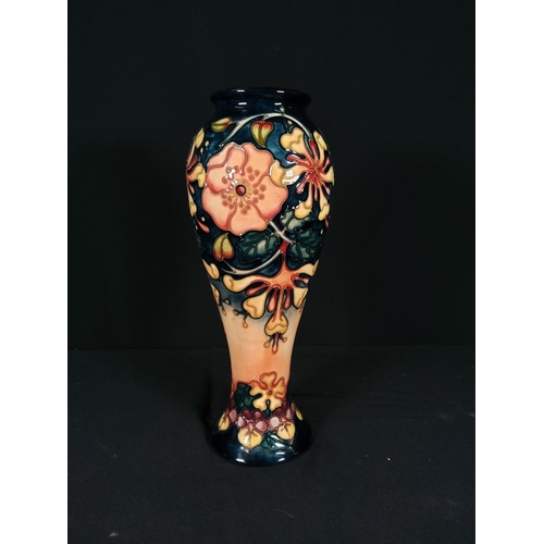 254 - Boxed tall Moorcroft vase with floral pattern initialled JK dated 1993, 28cms in height