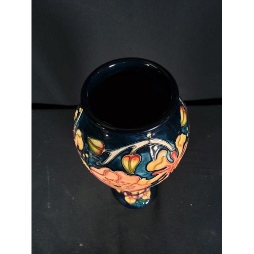 254 - Boxed tall Moorcroft vase with floral pattern initialled JK dated 1993, 28cms in height