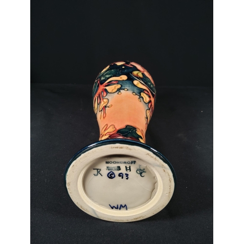 254 - Boxed tall Moorcroft vase with floral pattern initialled JK dated 1993, 28cms in height