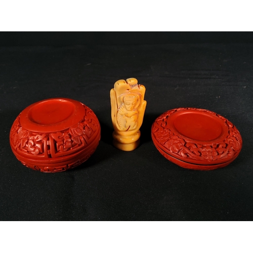 261 - 2 Cinnabar boxes and a carved stone hand with monkey