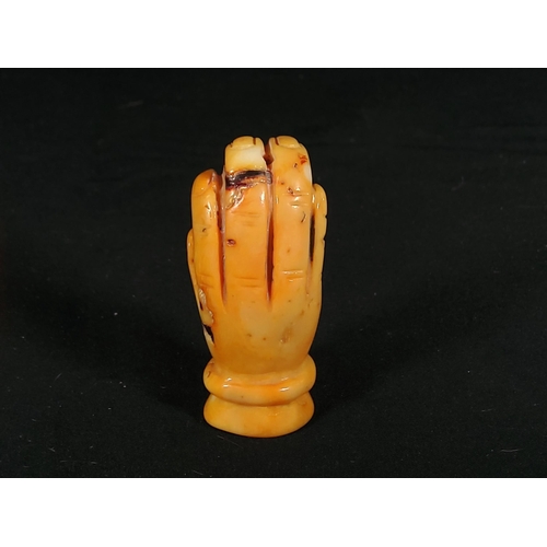 261 - 2 Cinnabar boxes and a carved stone hand with monkey