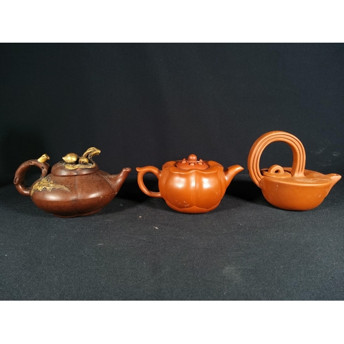 268 - 6 Oriental terracotta tea pots