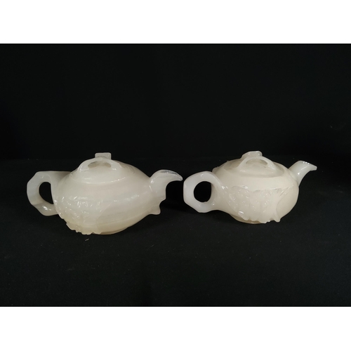 271 - 2 Oriental carved stone / Quartz teapots