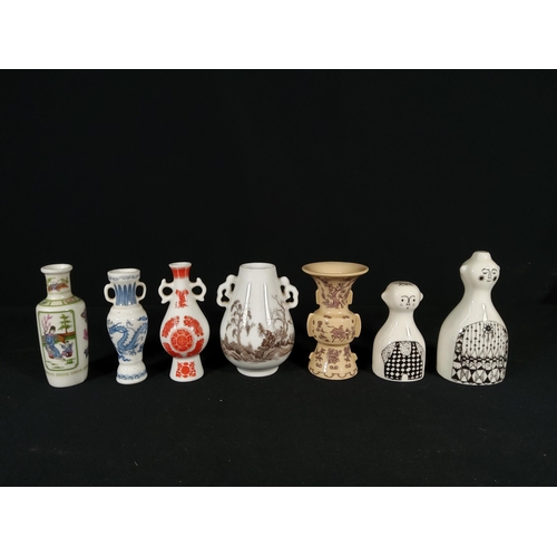 274 - Dutch pottery salt and pepper set and 5 miniature oriental vases