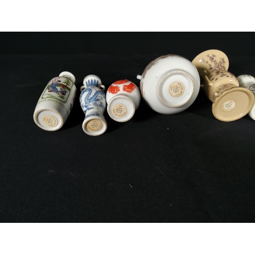 274 - Dutch pottery salt and pepper set and 5 miniature oriental vases