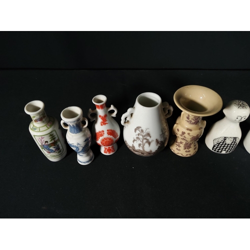 274 - Dutch pottery salt and pepper set and 5 miniature oriental vases