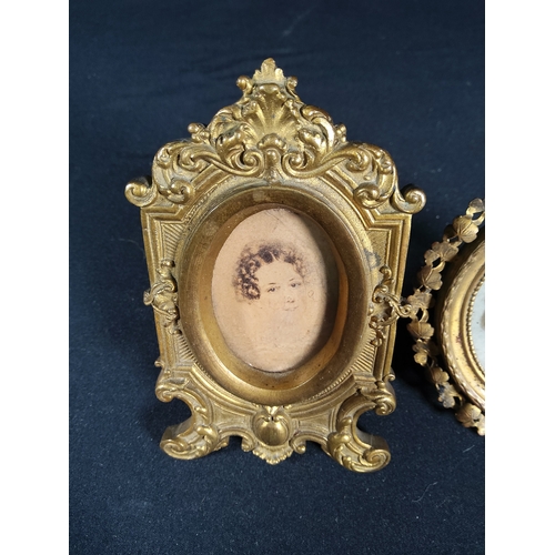 185 - 2 Antique metal framed miniatures - both gilded, one being 11 x 6cms and the other 9cms in diameter