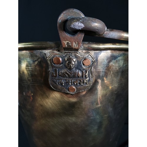 337 - Large antique brass bucket with markings, 32cms in height and 34cms in diameter