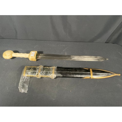 223 - Reproduction roman short sword with carved bone handle and leather sheath