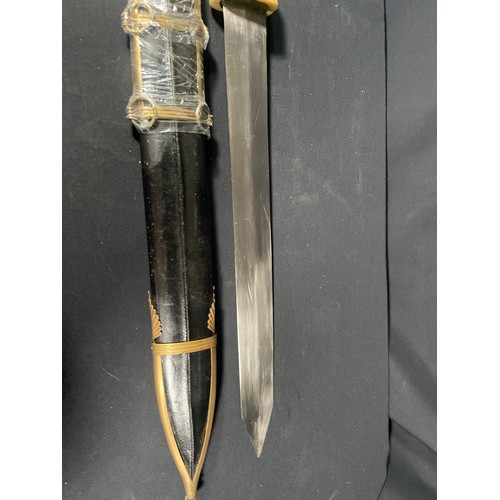 223 - Reproduction roman short sword with carved bone handle and leather sheath