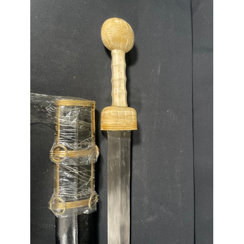 223 - Reproduction roman short sword with carved bone handle and leather sheath