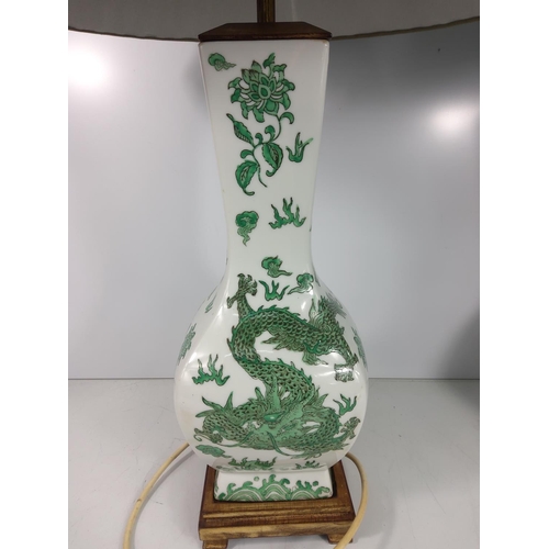 575 - Pair of green and white glazed Oriental dragon lamps with shades, height without shade approx 50cms ... 