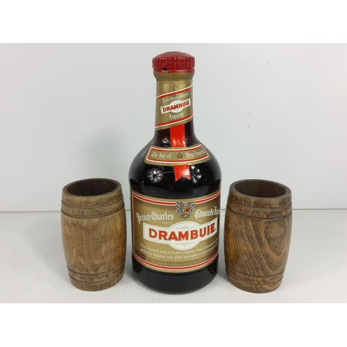 580 - Bottle of 1980's Drambuie and 2 dice cups