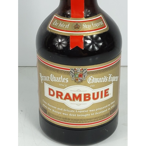 580 - Bottle of 1980's Drambuie and 2 dice cups