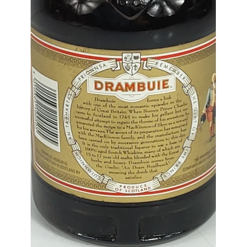 580 - Bottle of 1980's Drambuie and 2 dice cups