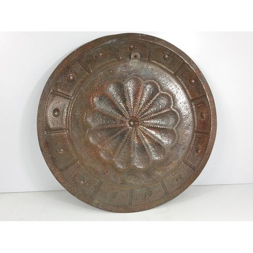 581 - Large late 19th Century copper wall charger signed to the rear and dated '95, approx 48cms in diamet... 