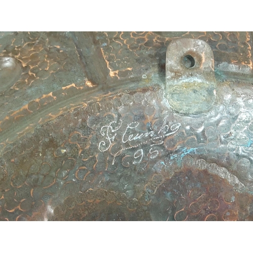 581 - Large late 19th Century copper wall charger signed to the rear and dated '95, approx 48cms in diamet... 