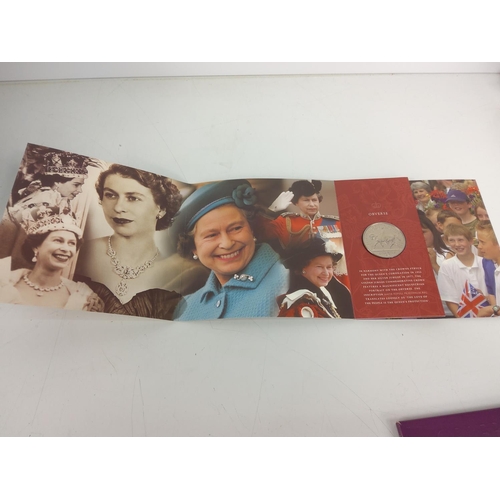 663 - Mounted Queens birthday crown, 3 other crowns and a Queen Elizabeth coin set