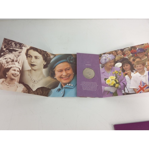 663 - Mounted Queens birthday crown, 3 other crowns and a Queen Elizabeth coin set