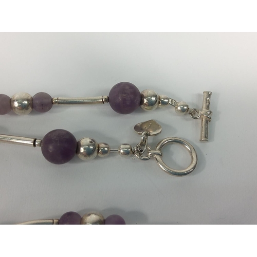 691 - Long silver and amethyst necklace