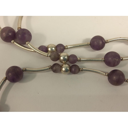 691 - Long silver and amethyst necklace