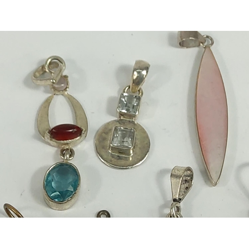 701 - Selection of various silver pendants