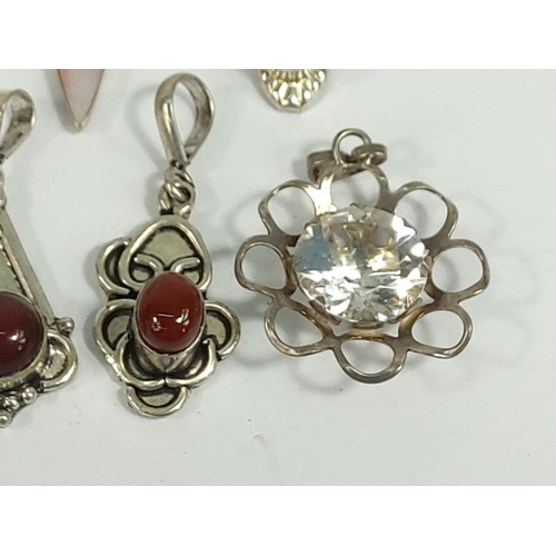 701 - Selection of various silver pendants