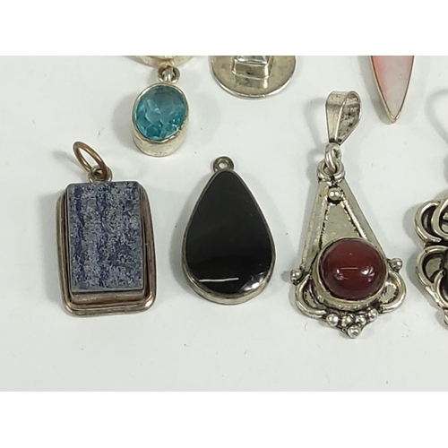 701 - Selection of various silver pendants